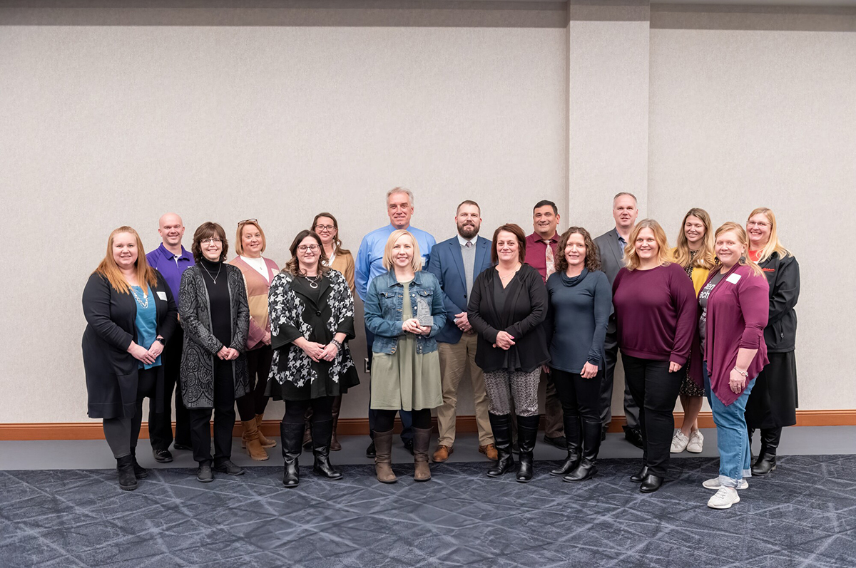 group of men and women standing in two rows